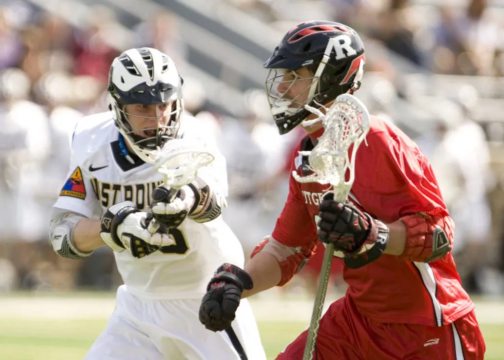 College lacrosse players in action during a game between Army and Rutgers