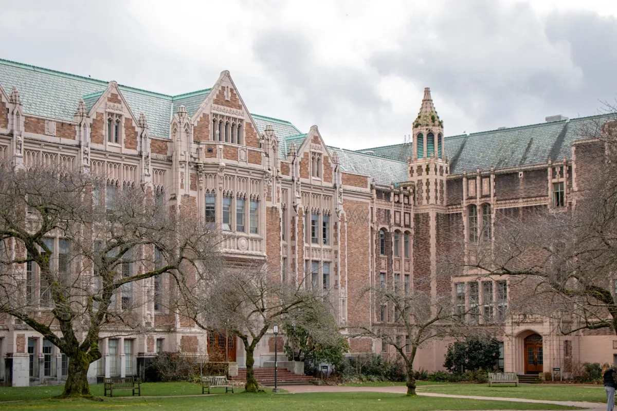A Gothic-style university building with stone archways and detailed architectural features